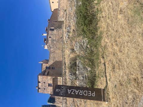 Historic stone fortification with sign.