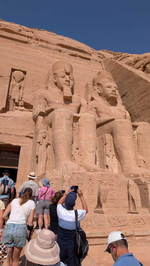       The statues of Abu Simbel carved into rock.
  