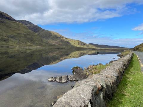       Reflection of mountains on a tranquil lake.
  