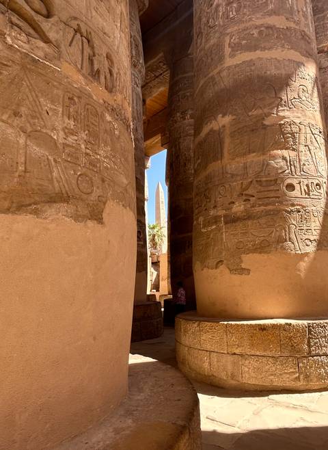 Close-up of pillars with hieroglyphics in an Egyptian temple.