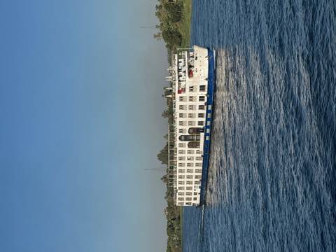 Cruise ship sailing on a river.