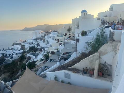       View of cliff-side buildings in Santorini
  