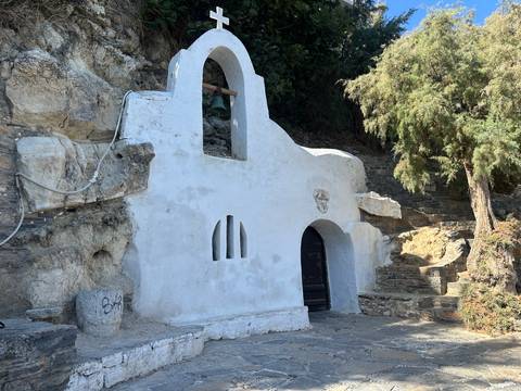       Small white chapel carved into rock
  
