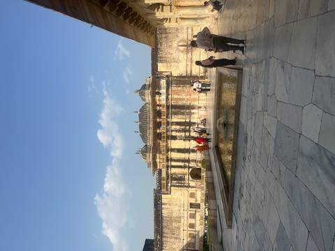 Ancient building with a courtyard and pool.