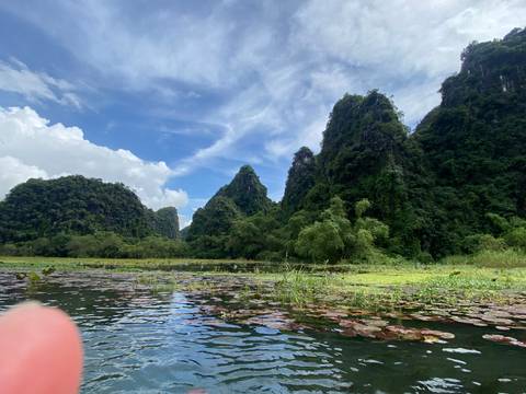 Dramatic landscape with limestone mountains and water.