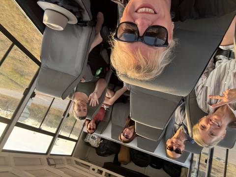 Group of people inside a vehicle.