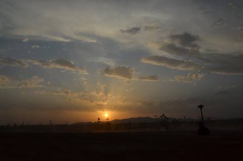       Sunset over a desert landscape.
  