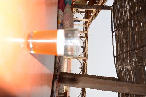       Blurred image of a glass of amber beer.
  