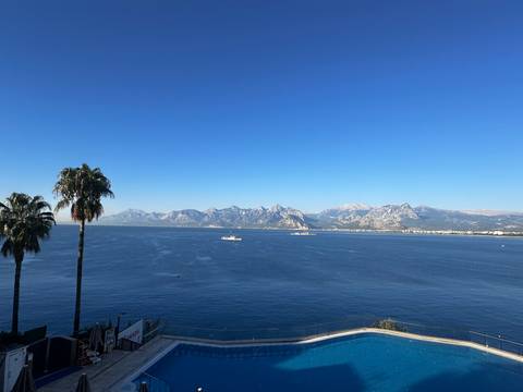       Scenic view of a sea with mountains in the background.
  