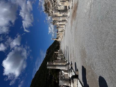 Ancient street lined with classical columns.