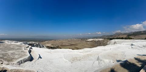 White terraces with a panoramic view of the landscape.