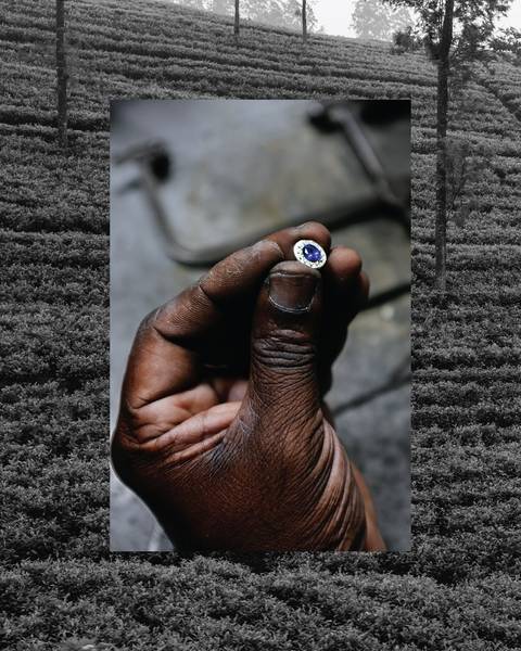 Close-up of a hand holding a gemstone.