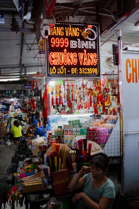 Market shop with decorative items and souvenirs for sale.