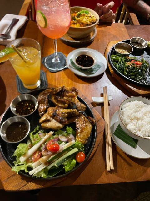 Close-up of a meal with chicken wings and rice