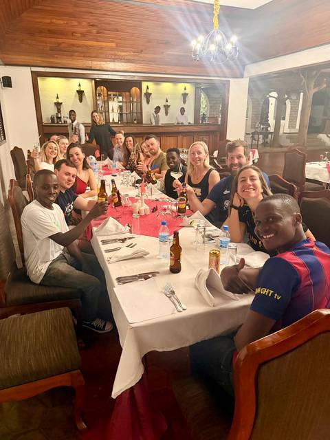 Group of people dining at a table in a restaurant.