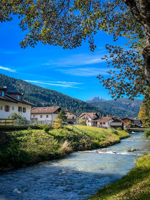 Village houses with mountains in the background.