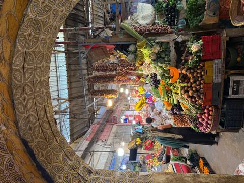 Bustling market with diverse fruits and vegetables.