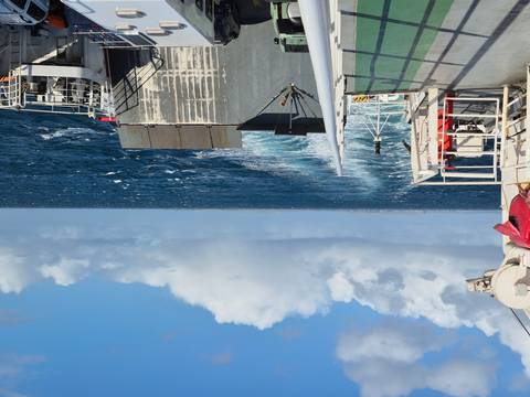       Ferry wake trailing off into the open ocean.
  
