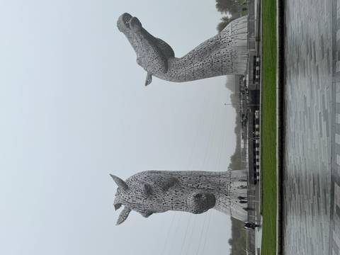 Large equine sculptures on a cloudy day.