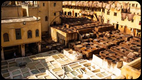 Overview of a traditional tannery with stone vats.