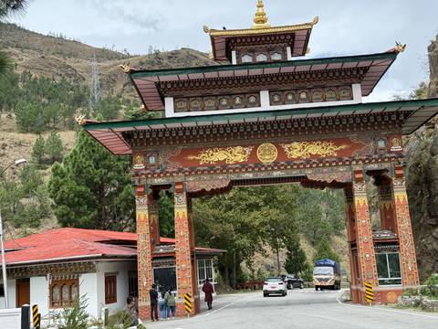       Ornate Bhutanese gate with colorful designs.
  