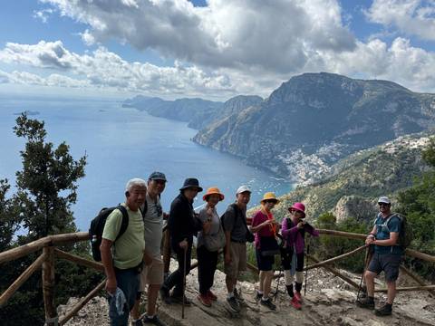 Group of hikers with a scenic coastal view.