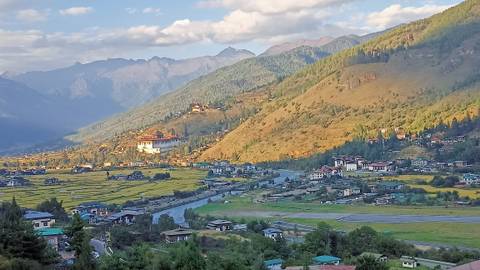 Scenic view of mountains and a valley with buildings