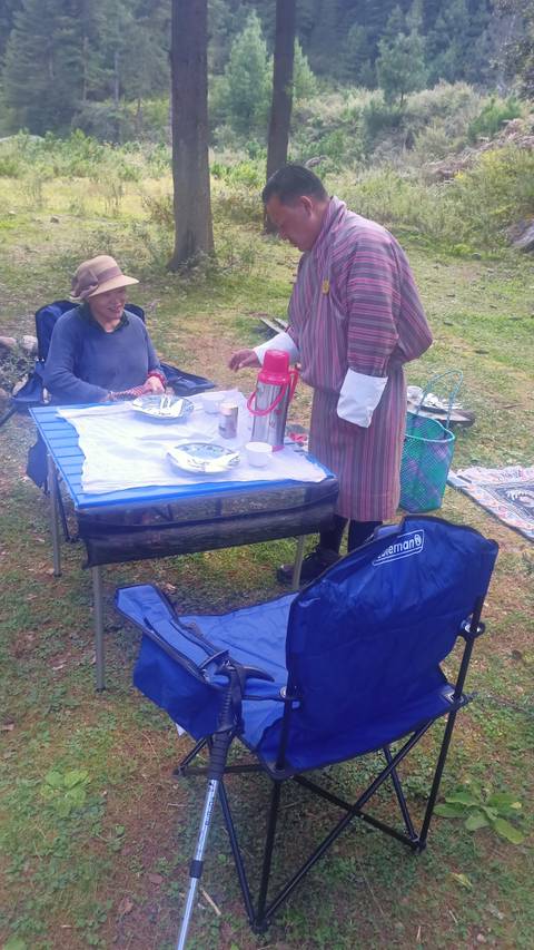 Outdoor picnic setup with traditional clothing