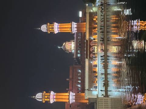 Golden temple with domes at night