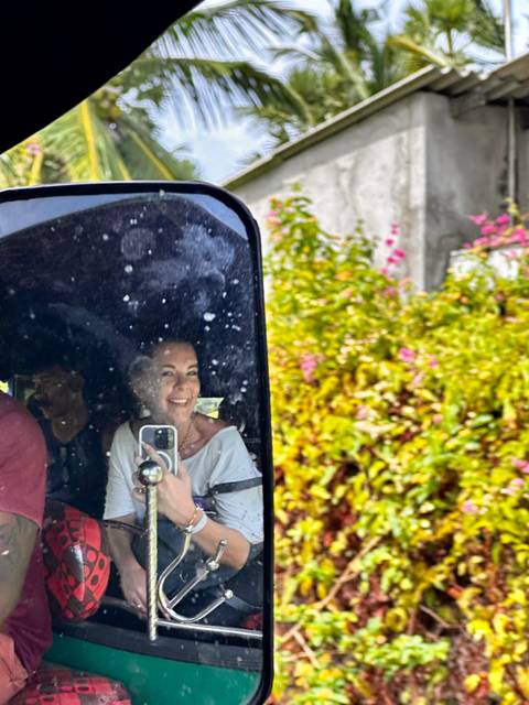 Person reflecting in a car window