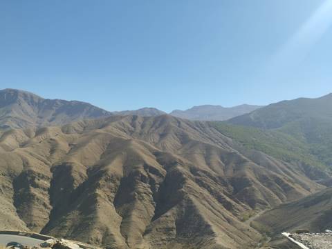       Mountain range under a clear blue sky.
  