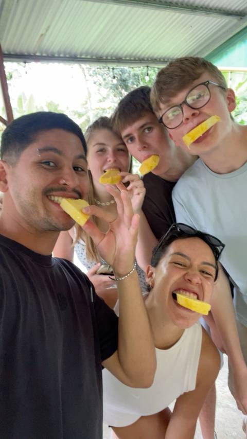 Group of friends enjoying fruit.