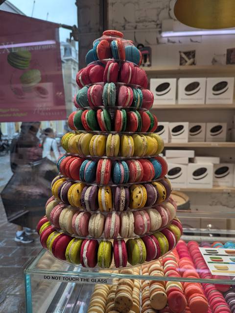       Close-up of a colorful macaron tower.
  