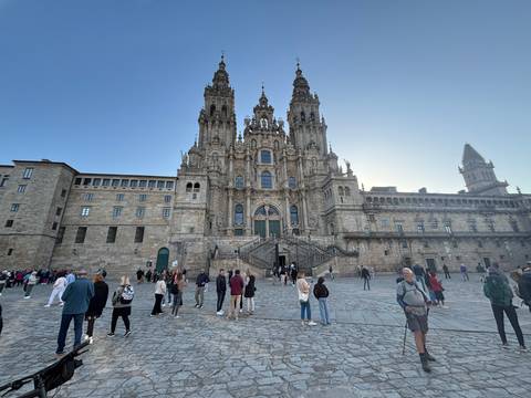       Crowd in front of a historic cathedral.
  