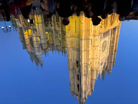       Illuminated cathedral against a night sky.
  