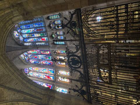       Stained glass windows inside a cathedral.
  