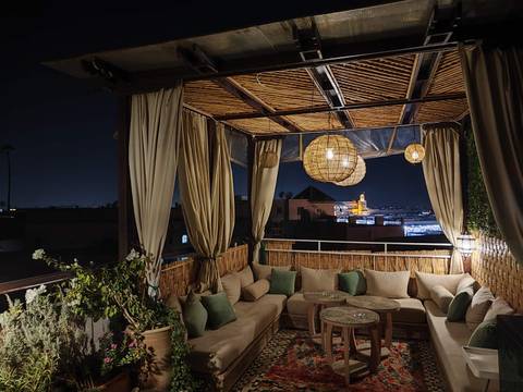 Cozy outdoor patio with a view of city lights.