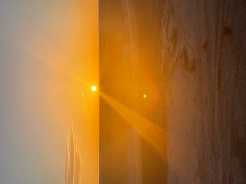 Dramatic sunset over a desolate landscape.