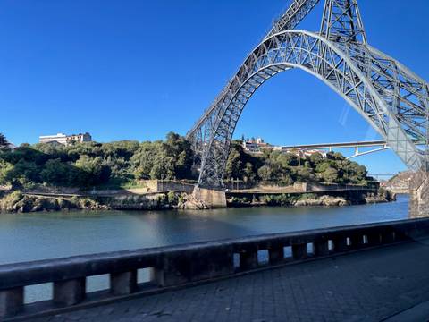       View of a large bridge over a river in Porto.
  