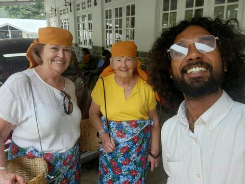 Group selfie of three people wearing headscarves.