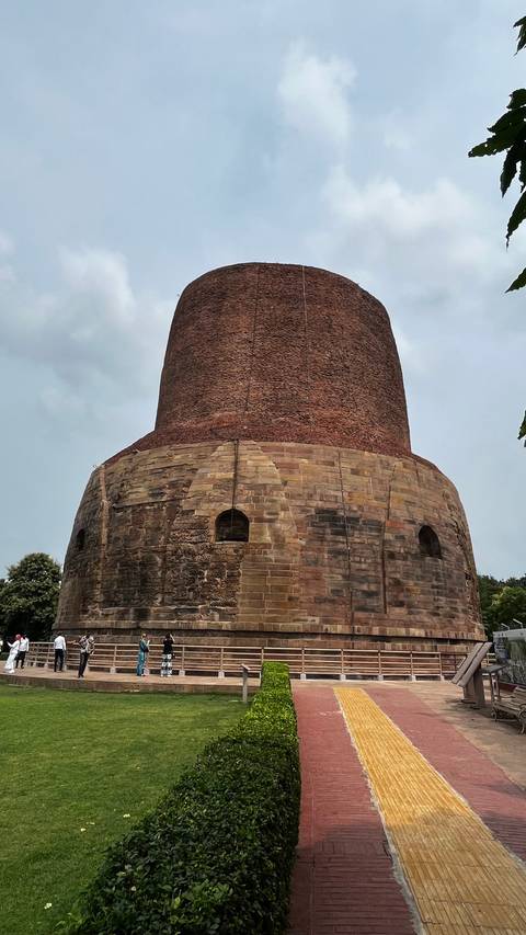 A large stupa with architectural carvings.