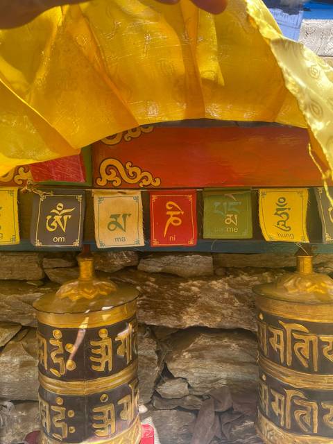 Close-up of multicolored prayer flags with inscriptions.