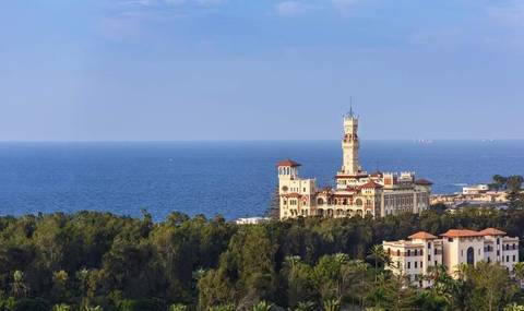 Beautiful building with a tower overlooking the sea.