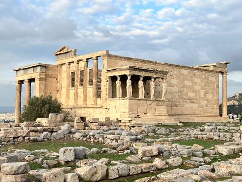 Ancient ruins with columns and stone structures.