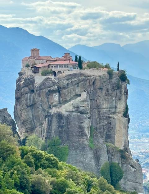 Rock monastery on a tall cliff with picturesque view.