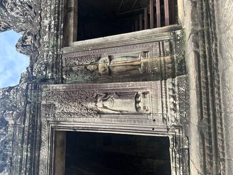 Ancient temple entrance with ornate stone carvings