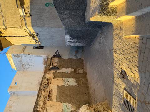 Narrow alleyway with textured walls