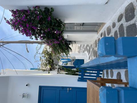       Charming alley in a village with white and blue accents.
  