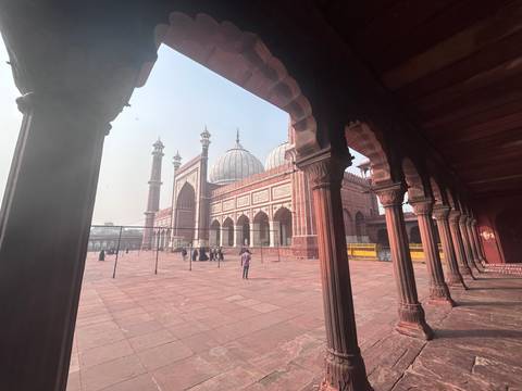       View of Jama Masjid from a hallway in Delhi.
  