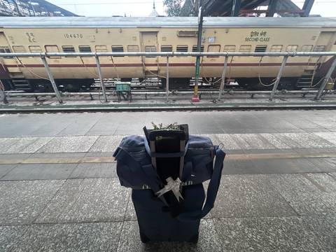Luggage on a train platform in India.